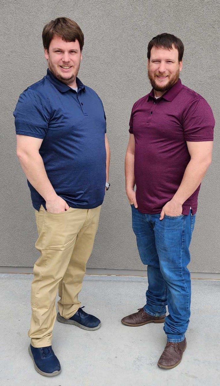 Two brothers posing for a photo together